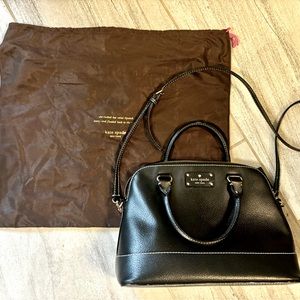 Black Kate Spade purse with sleeper bag